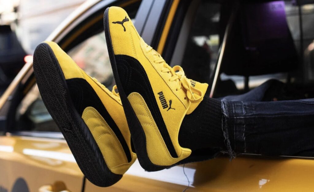 PUMA Speedcat OG sneaker in Pelé Yellow and Team Royal, low-profile design with suede upper and minimalist racing-inspired style
